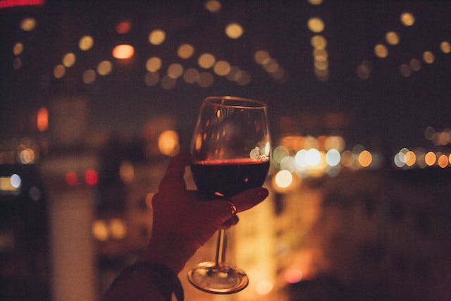 A woman raised her wine glass